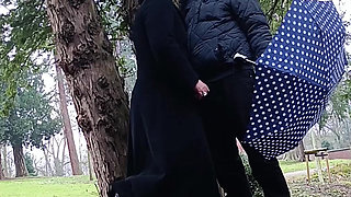 Muslim woman plays and blows a large cock outside in the park