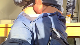 Slender boy jerks off his big cock on the construction site. Huge cumshot in work pants