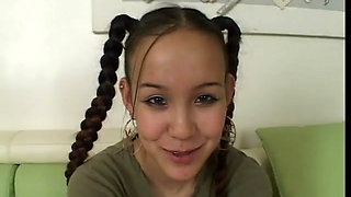 Brunette with pigtails sucks and slurps a fat cock on couch