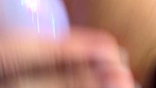 A Naughty Girl with Glasses Playing with Her Dildo