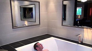A super sexy brunette massages her big boobs