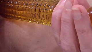 Playing with two glass dildos