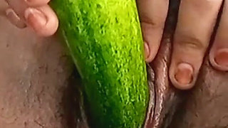 Teen college girl masturbating using cucumber