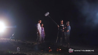 Blonde in Car During Nude Beach Film Shoot with Crew
