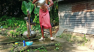 Desi young man bath Open place.
