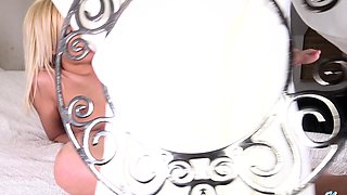 Tanned blonde babe in bikini masturbating under shower