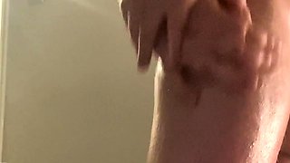 A super sexy brunette massages her big boobs