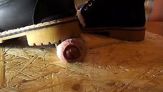 Domina crushes cock with high heels