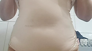 MILF taking off her clothes, urinating, leaving her vagina wet and hot.