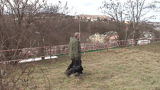 It's cold in the park and the young brunette with small natural tits gets warmed up by an old man and swallows all the cum