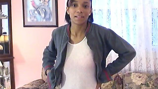 Cute little black chick shows off her skinny beautiful bod on a couch