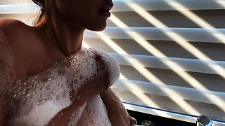 Hot babe with perfect big boobs taking shower