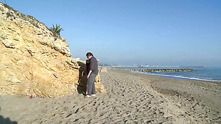 Young slut with dark hair gets pussy fucked on the beach