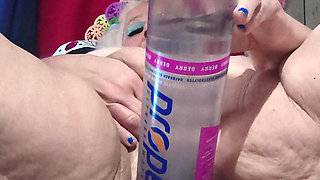 Big Bottle Plugged Clit Cunt