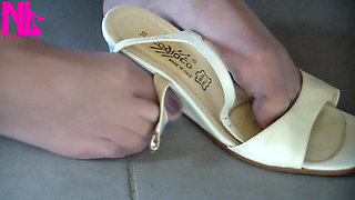 Nyllady Putting on Pantyhose and Footplay with Milk Colored Wedges