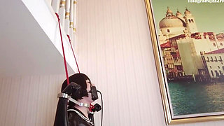 Mz24 - a Girl Bound to a Treadmill with Metal Restraints and Shackles