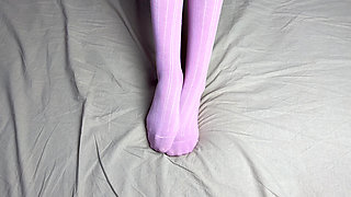 Pink socks in hands of mistress with blue nails in solo video