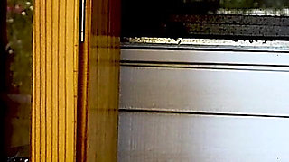 Shaved Head Goth Smokes Outside