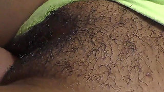 Close-up of a black hairy cunt filled with hot jizz