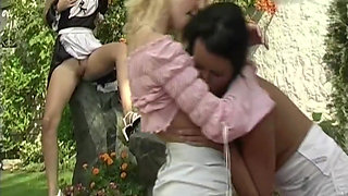 Blonde and Brunette Share Dildo Outdoors
