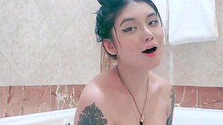 Busty babe playing with her big boobs