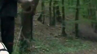 Humiliating whipping kneeling on the lake shore
