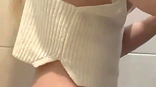 Busty Blonde Sucks Cock in the School Bathroom