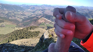 Jock in Fishnet Jerks His Big Fat Cock and Cums on Top of the Mountain